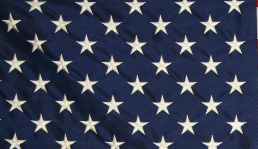 Close up of the white stars on the flag of the United States of America.