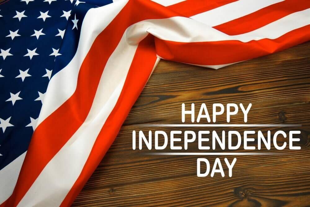 American Flag on table with banner Happy Independence Day!