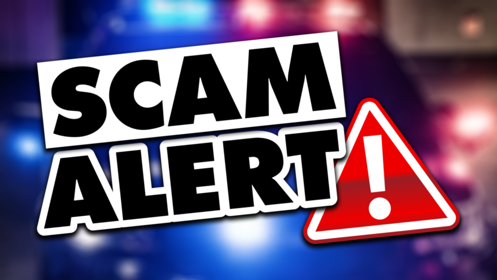 SCAM Alert with red exclamation triangle and police blue lights in the background