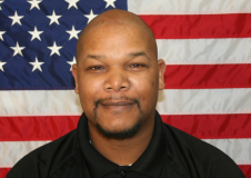 Sgt Smith in front of the American Flag